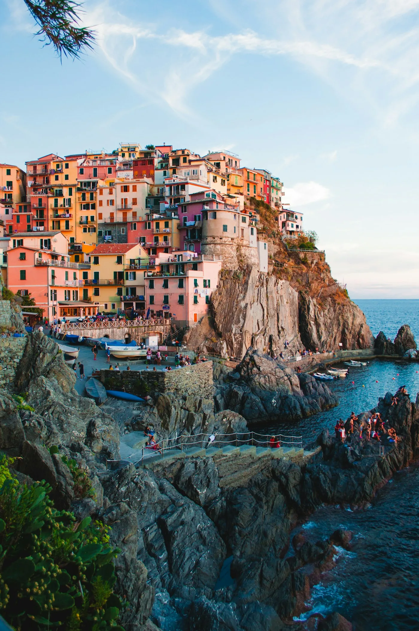 Colorful coastal buildings above a rocky shoreline